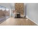 Open living room showcasing a stone fireplace and sliding door to balcony at 13633 E Yale Ave # B, Aurora, CO 80014
