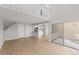Bright living room with stairway, recessed lights, and access to private outdoor balcony at 13633 E Yale Ave # B, Aurora, CO 80014