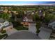 Stunning aerial view of a home nestled in a mature neighborhood with a well-manicured lawn at 3566 E Meadow Creek Pl, Highlands Ranch, CO 80126