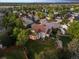Aerial view of a beautiful home with a covered patio in a lush, green neighborhood at 3566 E Meadow Creek Pl, Highlands Ranch, CO 80126