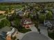 Aerial view of a home with a large backyard and charming curb appeal, in a Gathering-friendly neighborhood at 3566 E Meadow Creek Pl, Highlands Ranch, CO 80126