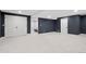 Spacious finished basement with neutral carpet offers versatile living space with access to additional rooms at 3566 E Meadow Creek Pl, Highlands Ranch, CO 80126