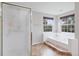 Bright bathroom with a separate shower, a large tub, and plenty of natural light from multiple windows at 3566 E Meadow Creek Pl, Highlands Ranch, CO 80126
