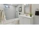 Elegant bathroom featuring modern vanity, stylish mirror, and walk-in shower at 2784 E Maplewood Ave, Centennial, CO 80121