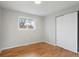 Bedroom with hardwood floors, closet, and natural light at 2784 E Maplewood Ave, Centennial, CO 80121