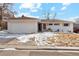 Charming white brick home with a well-manicured lawn and a two-car garage, complete with a cozy, inviting curb appeal at 2784 E Maplewood Ave, Centennial, CO 80121