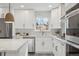 Bright kitchen featuring white cabinetry, stainless steel appliances, and modern finishes at 2784 E Maplewood Ave, Centennial, CO 80121