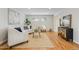 Cozy living room featuring hardwood floors, a comfortable sectional sofa, stylish accent pillows, and modern decor at 2784 E Maplewood Ave, Centennial, CO 80121