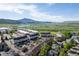Aerial view of a residential neighborhood with mountain views and a parking lot at 4290 S Deframe St, Morrison, CO 80465