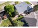 Aerial view showcases a landscaped backyard with a patio, hot tub, and mature trees at 4290 S Deframe St, Morrison, CO 80465