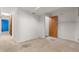 Unfinished basement with carpet and access to multiple rooms at 4290 S Deframe St, Morrison, CO 80465