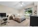 Bright bedroom featuring a large window, neutral colors, and vaulted ceilings at 4290 S Deframe St, Morrison, CO 80465