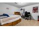 Bedroom with a bed, desk, chair, and a Spiderman poster on the wall at 4290 S Deframe St, Morrison, CO 80465