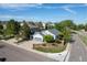 Corner lot home with manicured lawn, brick flower beds, and an attached two-car garage at 4290 S Deframe St, Morrison, CO 80465
