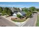 Corner lot home with manicured lawn, brick flower beds, and an attached two-car garage at 4290 S Deframe St, Morrison, CO 80465