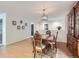 Inviting dining room with hardwood floors, a chandelier, and stylish decor, perfect for Gathering meals at 426 N 48Th Ave, Brighton, CO 80601