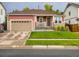 Charming single-Gathering home with a well-maintained lawn and an attached garage, perfect for suburban living at 426 N 48Th Ave, Brighton, CO 80601