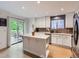 Bright kitchen featuring an island with a marble countertop, white cabinetry, and stainless steel appliances at 426 N 48Th Ave, Brighton, CO 80601