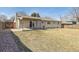 Spacious backyard featuring a covered patio perfect for outdoor entertaining, and a wooden fence for privacy at 2172 S Harlan St, Denver, CO 80227