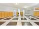 Basement featuring tiled floor, wood paneling, neutral-colored walls, recessed lighting, and doorways at 2172 S Harlan St, Denver, CO 80227