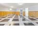 Finished basement featuring tiled floor, wood paneling, neutral-colored walls and recessed lighting at 2172 S Harlan St, Denver, CO 80227
