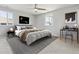 A light-filled bedroom with a ceiling fan, neutral walls, and modern decor at 2172 S Harlan St, Denver, CO 80227
