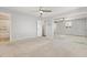 An empty bedroom with mirrored closet doors, carpet, and neutral walls at 2172 S Harlan St, Denver, CO 80227