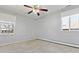 A bedroom featuring a ceiling fan, and two windows to allow for great light at 2172 S Harlan St, Denver, CO 80227