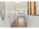 Inviting entryway with hardwood floors, view of dining room with chandelier, and a beautiful front door at 2172 S Harlan St, Denver, CO 80227