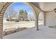 Covered brick front porch with view of the street at 2172 S Harlan St, Denver, CO 80227