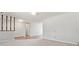 Open concept living room with carpet and view of dining and hallways at 2172 S Harlan St, Denver, CO 80227