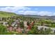 Aerial shot of the property highlighting its location and surrounding greenery and mountain views at 44 S Holman Way, Golden, CO 80401