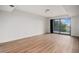 Spacious basement with wood-look flooring and sliding glass doors for natural light at 44 S Holman Way, Golden, CO 80401