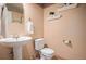 The bathroom includes a pedestal sink, a modern toilet, and neutral walls at 44 S Holman Way, Golden, CO 80401