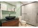 Modern bathroom featuring a unique vessel sink, frameless shower, and contemporary fixtures at 44 S Holman Way, Golden, CO 80401