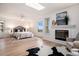 Bright bedroom with a skylight, fireplace, and large windows offering scenic views at 44 S Holman Way, Golden, CO 80401
