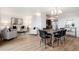 Bright, open living and dining area with wood floors and neutral furnishings at 44 S Holman Way, Golden, CO 80401