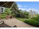Relaxing outdoor patio area with a built-in grill and views of the lush landscaping at 44 S Holman Way, Golden, CO 80401