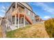 Charming backyard features a wooden deck and stairs, perfect for outdoor entertaining and relaxing at 5190 Ditmars Trl, Castle Rock, CO 80104