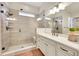 Modern bathroom showcasing a glass enclosed shower, bright vanity, and elegant finishes at 5190 Ditmars Trl, Castle Rock, CO 80104
