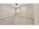 Large bedroom featuring neutral walls and carpet with a ceiling fan and window at 5190 Ditmars Trl, Castle Rock, CO 80104