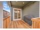 Cozy covered deck with sliding glass door, perfect for enjoying the outdoors in any weather at 5190 Ditmars Trl, Castle Rock, CO 80104