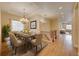 Spacious dining room with elegant chandelier, hardwood floors, and view into other living spaces at 5190 Ditmars Trl, Castle Rock, CO 80104