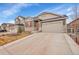 Beautiful front exterior featuring stone accents and a two-car garage in a well-maintained neighborhood at 5190 Ditmars Trl, Castle Rock, CO 80104