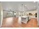 Open-concept living space with modern fireplace, spacious island, and lots of natural light at 5190 Ditmars Trl, Castle Rock, CO 80104
