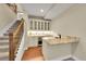 Basement wet bar featuring granite countertop, wine fridge, and glass-front cabinets at 5190 Ditmars Trl, Castle Rock, CO 80104