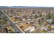 Wide aerial view of a suburban community with numerous homes, streets, and trees creating a peaceful residential setting at 96 S Depew Dr, Lakewood, CO 80226