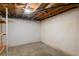 Unfinished basement ready for customization, featuring exposed ceilings and concrete floors at 96 S Depew Dr, Lakewood, CO 80226