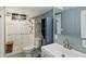 Modern bathroom featuring a glass-enclosed shower, sleek vanity, and contemporary fixtures at 96 S Depew Dr, Lakewood, CO 80226