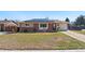 Inviting single-Gathering home with solar panels, a brick facade, and a well-manicured front yard at 96 S Depew Dr, Lakewood, CO 80226
